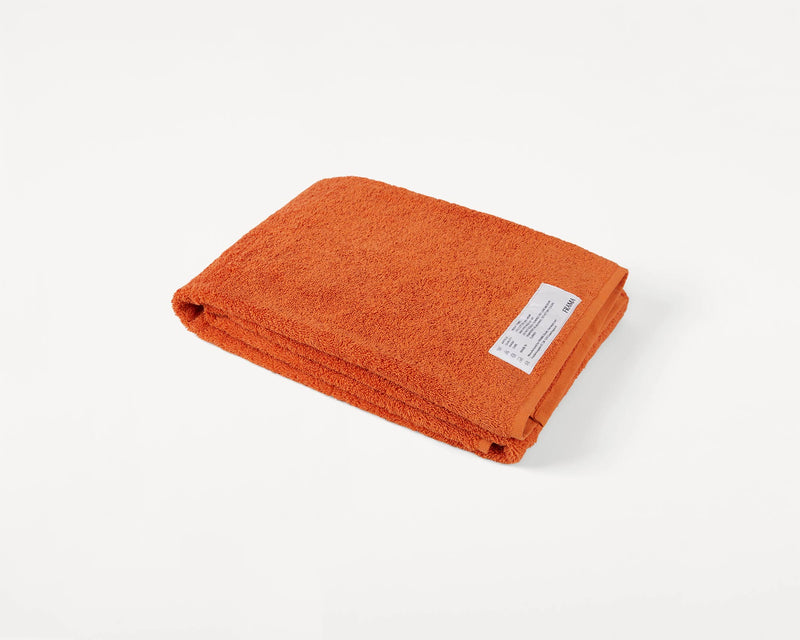 https://framacph.com/cdn/shop/products/2935_50d2f12c1b-frama-heavy-towel-burn-orange-bath-towel-packshot-1-original_800x.jpg?v=1655324395